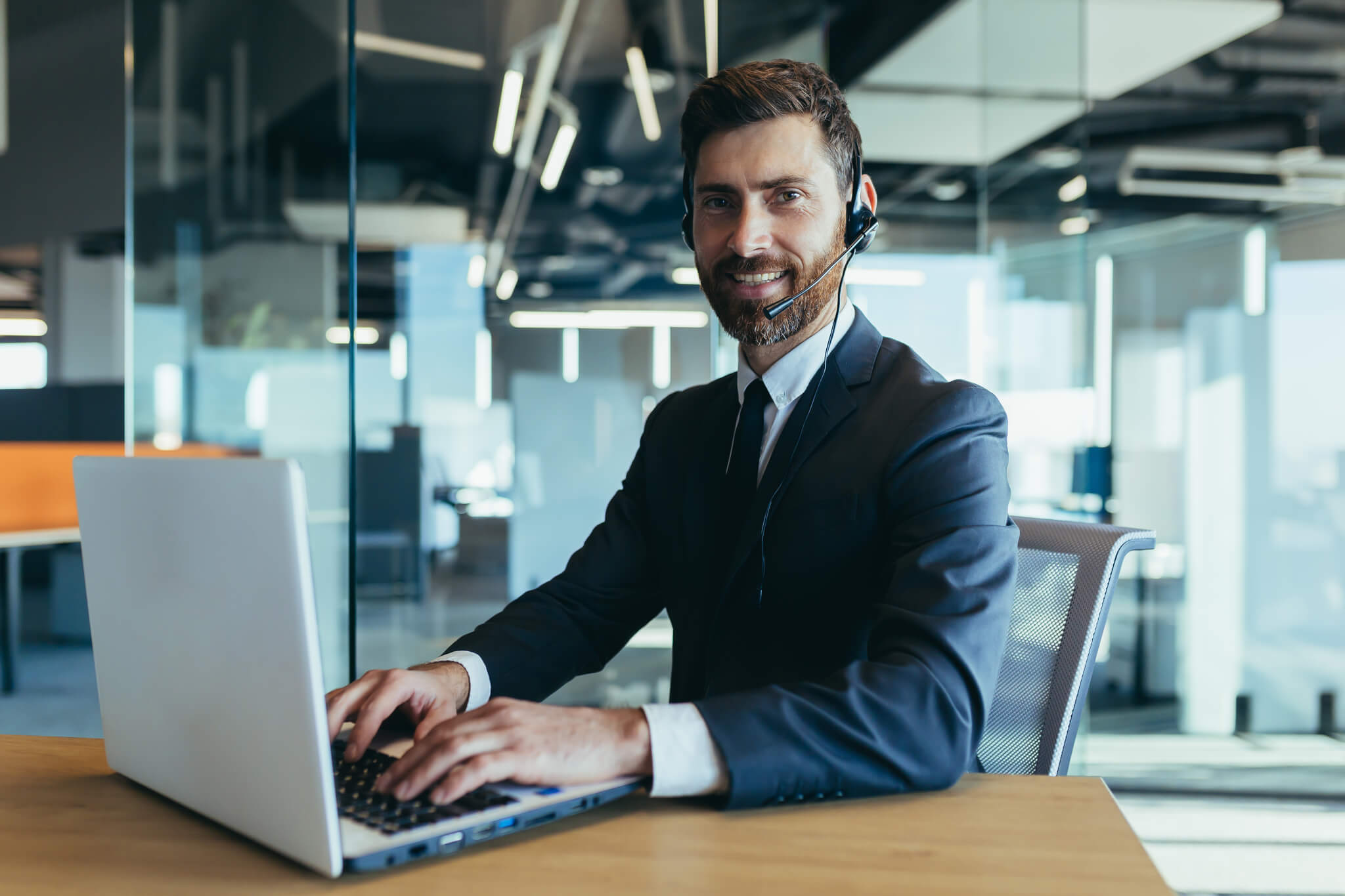 An employee of the call center looks at the camera