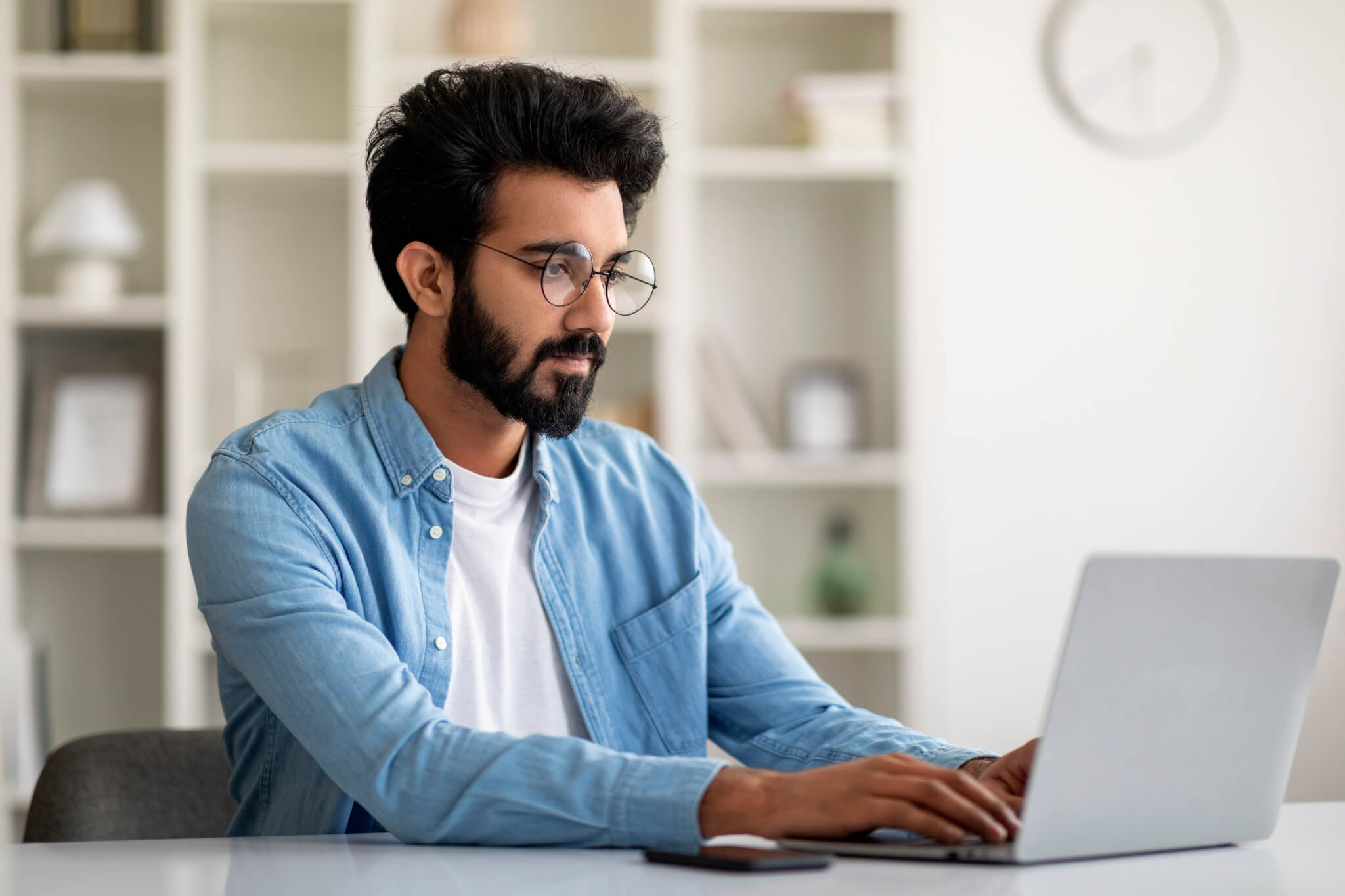 Freelance Work. Handsome Young Indian Man Working On Computer At Home Office