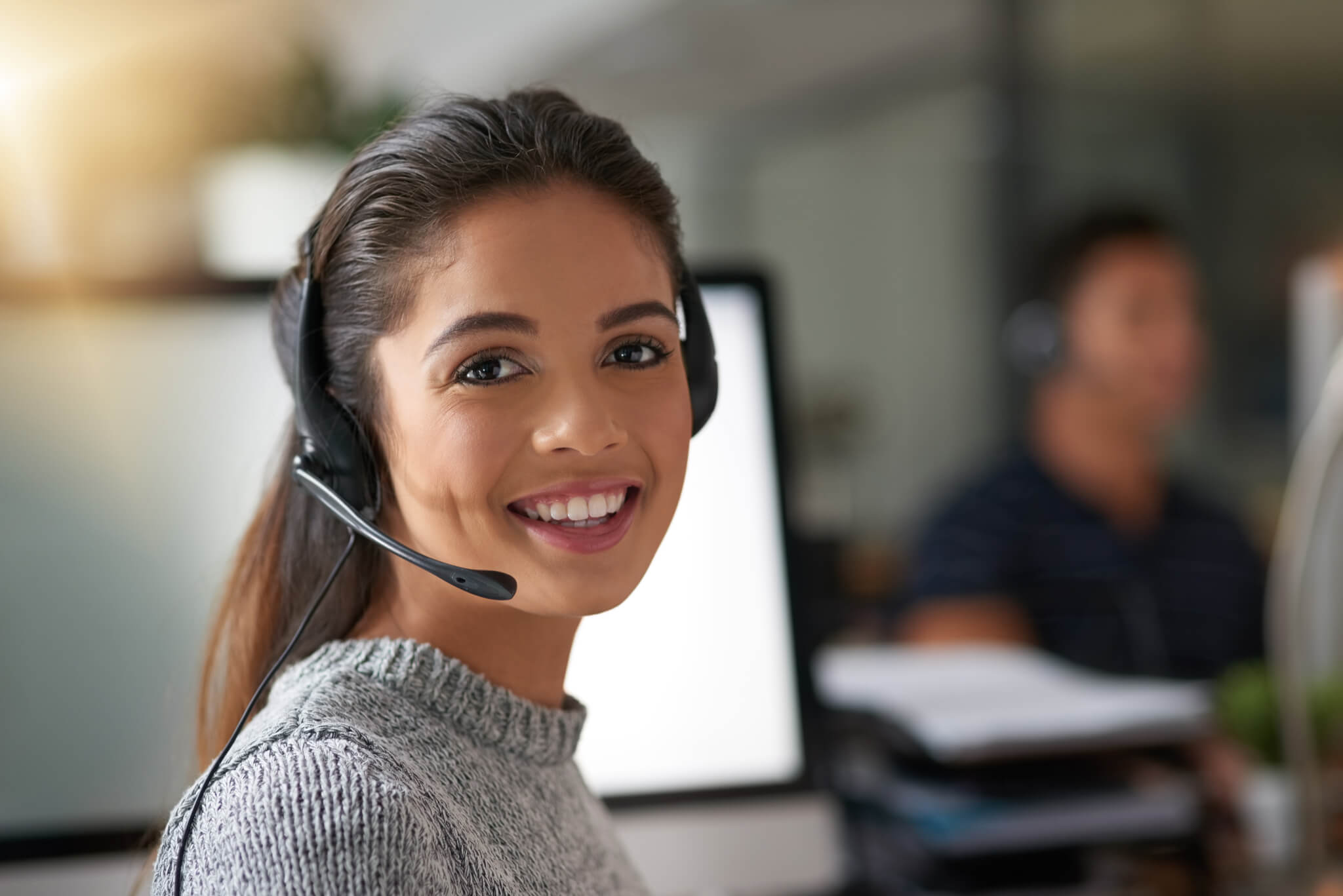 How may they help you. Shot of young agents working in a call center.