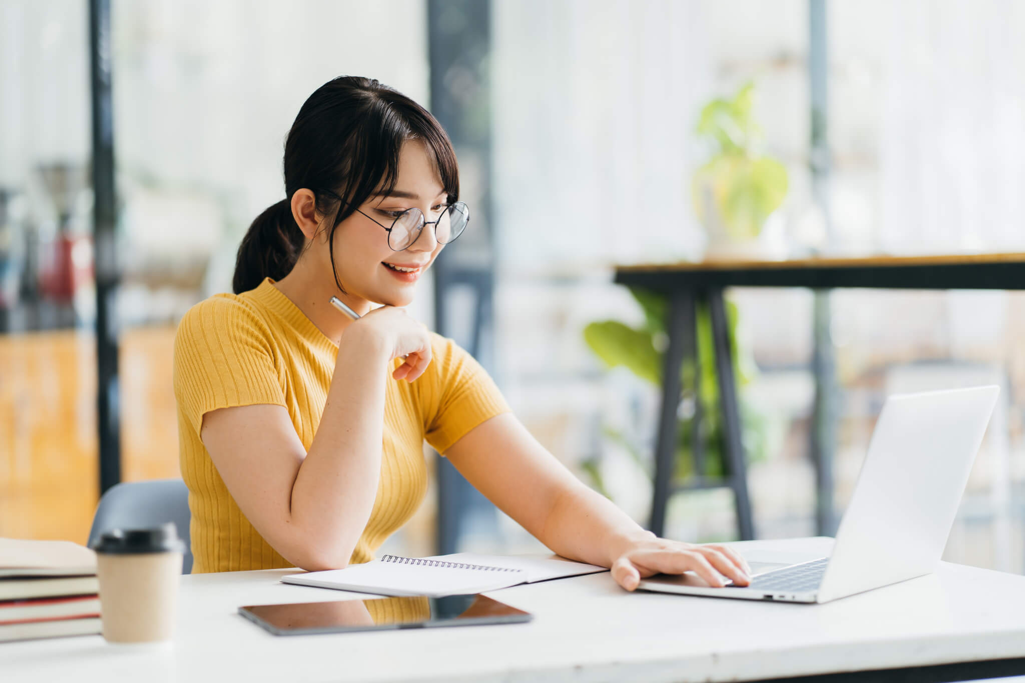 Skilled female software developer working on freelance use code libraries to simplify the transcript